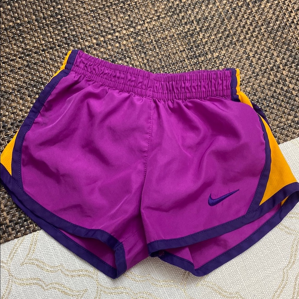 Nike Women's Vibrant Purple and Gold Athletic Shorts